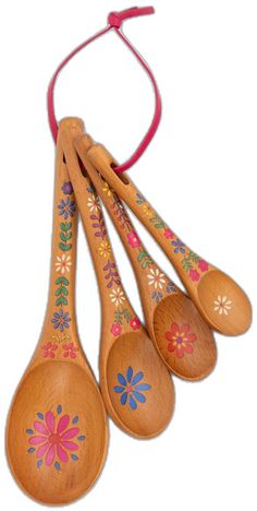 six wooden spoons with painted designs hanging from a red string on a white background