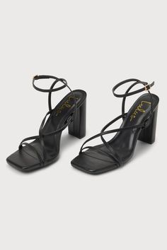 The Lulus Makennaa Black Strappy High Heel Ankle Strap Sandals are the perfect finishing touch to any flirty going-out look! These sleek heels have a smooth faux leather construction that shapes a square toe bed, a slender toe strap, and matching vamp straps that create a crisscrossing effect. An adjustable ankle strap sprouts from the sides and secures with a shiny gold buckle, all atop a chic block heel. 3. 75" wrapped block heel. Cushioned insole. Rubber sole has nonskid markings. Man made ma Trendy Ankle Strap Heels With Wrapped Heel, Trendy Heels With Ankle Strap And Wrapped Heel, Chic Ankle Strap Synthetic Heels, Chic Ankle Strap Heels In Synthetic Material, Chic Synthetic Ankle Strap Heels, Sleek Square Toe Heels For Date Night, Chic Strappy Heels With Heel Strap, Date Night Ankle Strap Heels In Synthetic Material, Synthetic Ankle Strap Heels For Date Night