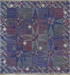 a blue and red rug with stars on it