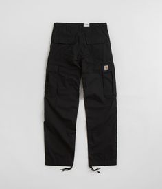 Carhartt Regular Cargo Pants in Black. Regular fitting with a low waist and double layered knee panels, these rinsed Carhartt cargo pants are crafted from 100% cotton ‘Columbia’ ripstop. Featuring a belt loop waist, a single button secured YKK zipper fly and adjustable drawcord hems, these black Carhartt pants are finished with four classic pockets, two additional utility pockets and with an embroidered brand patch sewn across the right leg. Inspired by their industrial heritage and by an appreciation for quality craftsmanship, Carhartt is a pioneering workwear label founded in 1889. Focused on functionality and adaptability at their core, Carhartt celebrated 25 years of its WIP subdivision in 2019, whilst their time honoured better-buy ethos is one that remains a creative reflection of th Black Carhartt Pants, Christmas Presents For Boys, Carhartt Cargo Pants, American Workwear, Carhartt Cargo, Carhartt Pants, Utility Pockets, Skateboard Store, Black Cargo