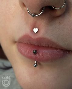 a woman with two piercings attached to her nose