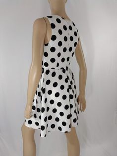 "Women's Dress Black White Polka Dot Classic Vintage by ALYA SIZE S Black and white LARGE polka dots sleeveless pull over dress with scoop neck. High quality. Excellent like new condition. Easy to wear casual chic vintage for the disco sporting life. MEASUREMENTS: Length - 32.5\" Bust (underarms to underarms) - 33-36\" Waist - 27\"unstretched Hips -22\"x2 MODEL STATS: Ht. - 5' 8.5\" Bust - 34\" Waist - 25\" Hips - 35\" *Please check measurements to ensure proper fit and remember to allow extra r Polka Dot Sleeveless A-line Dress For Summer, Polka Dot Knee-length Sleeveless Dress For Spring, Polka Dot Sleeveless Lined Dress, Casual Polka Dot Sleeveless Party Dress, Casual Polka Dot Sleeveless Dress For Party, Fitted Polka Dot Sleeveless Dress For Spring, Fitted Polka Dot Sleeveless Casual Dress, Casual Fitted Sleeveless Polka Dot Dress, Fitted Casual Sleeveless Polka Dot Dress