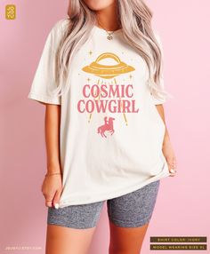 Cosmic Cowgirl UFO Comfort Colors Unisex T-shirt Design by jojoyu. This item is made to order. If you want an oversized fit please size up one or two sizes! for reference, the model in the photo is usually a medium but wearing XL for an oversized fit. Please note that the colors on the actual shirt might slightly differ from the photos. This is due to different color display on different devices, monitors, as well as the colors of an image may be affected by different lighting conditions. About Cosmic Cowboy, Cowgirl Tee Shirts, Cowgirl Graphic Tees, Retro Cowgirl Shirts, Oversized Western Tee, Comfort Colors Tshirt, Cowgirl Shirts, Oversized Graphic Tee, Retro Shirts