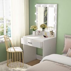 a bedroom with a vanity, mirror and chair next to a window in the room