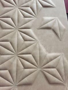 an upholstered mattress with stitching on it