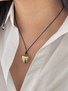 Shiny finished chubby heart pendant on long cord chainCute and Essential design for the Valentine's Day collection- Brass alloy, Faux leather- Heart: 19x18mm- Length: approx. 75cm Gold Heart Jewelry With Adjustable Cord, Elegant Heart-shaped Necklace With Adjustable Cord, Gold Jewelry With Adjustable Cord For Valentine's Day, Valentine's Day Heart Pendant Necklace With Adjustable Cord, Heart Pendant Necklace With Adjustable Cord, Adjustable Cord Heart Pendant Jewelry Gift, Adjustable Metal Necklace With Heart Pendant, Adjustable Metal Heart Pendant Charm Necklace, Everyday Adjustable Heart Pendant Charm Necklace