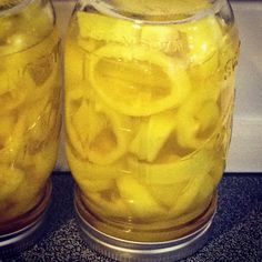 two mason jars filled with sliced lemons