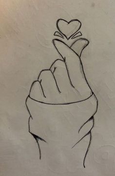 a drawing of a hand with a heart on it