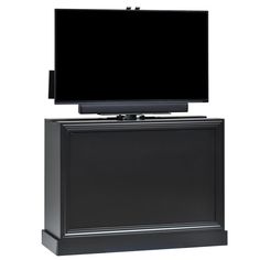 a flat screen tv sitting on top of a black cabinet