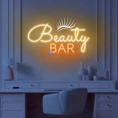 a neon sign that says beauty bar on the wall above a desk with a chair