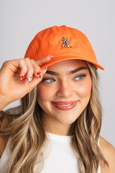 OSU Pistol Pete tennis hat from Lush Fashion Lounge women's boutique in Oklahoma City. Lush boutique in OKC has a variety of cute gameday accessories! This OSU hat is the perfect accessory to your gameday outfit! These hats are locally made right here in Oklahoma! Adjustable strap back. Trendy Spring Baseball Cap For Sports Events, Casual Game Day Hat With Curved Visor, Casual Curved Brim Baseball Cap For Tennis, Casual Curved Visor Hat For Game Day, Casual Baseball Cap With Curved Brim For Tennis, Adjustable Casual Baseball Cap For Tennis, Casual Adjustable Dad Hat For Game Day, Casual Orange Hat For Sports Events, Casual Summer Tennis Hat