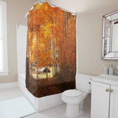 a bathroom with a shower curtain that has an orange and black marble pattern on it