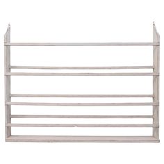 a white wooden shelf with two hooks on it