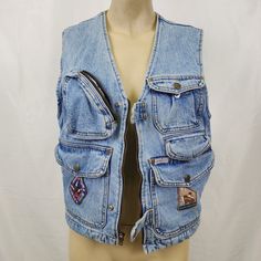 Are you ready to take a trip back to the '90s with this vintage Guess denim vest? This vest is made of 100% cotton and denim, so you know it's durable enough to survive whatever adventures come your way. And with multiple pockets you'll have plenty of space to store all of your essentials. This vest also features some cool iron-on patches. But the best part? For $245 you can own a piece of '90s fashion history. But how do you style a denim vest from the '90s? It's easy. You can go full-on grunge with ripped jeans and combat boots, or keep it more modern with some high-waisted shorts and chunky sneakers. And let's not forget about the versatility - this vest is perfect for any occasion, whether you're heading to a concert or just running errands. But be warned, if you wear this vest, you're Outdoor Sleeveless Denim Vest With Pockets, Vintage Streetwear Vest With Pockets, Vintage Cotton Vest For Outdoor, Vintage Denim Vest For Streetwear With Pockets, 90s Cotton Denim Vest With Pockets, 90s Style Cotton Denim Vest With Pockets, Vintage Denim Jacket For Outdoors, Vintage Denim Jacket For Outdoor, Casual Upcycled Vest