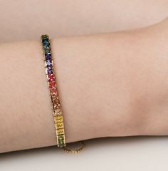 Wear this rainbow Bracelet whenever, wherever, alone of pair it with friends. It will complete your subtle, elegant look for any holiday season. It will shine you on all occasions. Check what's cool about it:  * Premium 18k gold vermeil over 925 sterling silver  * Adjustable chain bracelet for comfortable, customized fit  * Vibrant 4mm x 4mm rainbow gemstones  * 7.5 inch chain length  * FREE domestic US shipping! ✨Please note, due to the nature of gold vermeil, some gradual wear over time is to Rainbow Cubic Zirconia Bracelets For Gift, Rainbow Cubic Zirconia Bracelets As Gift, Rainbow Cubic Zirconia Bracelet For Gift, Rainbow Cubic Zirconia Bracelet As Gift, Rainbow Bangle Jewelry For Friendship, Adjustable Multicolor Tennis Bracelet Gift, Adjustable Multicolor Tennis Bracelet As Gift, Adjustable Multicolor Tennis Bracelet, Rainbow Jubilee Bracelet As Gift