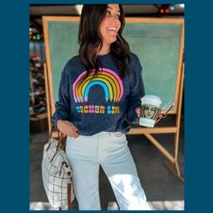 This amazing Teacher Life Rainbow Sweatshirt is made with breathable material to offer you a cozy comfort all day long. The beautiful rainbow colors make it so stylish, while the pullover style makes for easy wear. Pair it with anything from denim to drawstring joggers and sneakers for a relaxed vibe. Trendy Multicolor Relaxed Fit Sweatshirt, Casual Rainbow Crew Neck Sweatshirt, Casual Rainbow Print Relaxed Fit Top, Casual Relaxed Fit Rainbow Print Tops, Casual Rainbow Print Top With Relaxed Fit, Casual Rainbow Relaxed Fit Top, Casual Rainbow Print Top For Fall, Casual Multicolor Sweatshirt, Trendy Relaxed Fit Tops With Rainbow Print