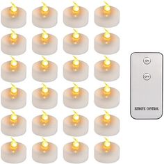 a bunch of white lights sitting on top of each other next to a remote control