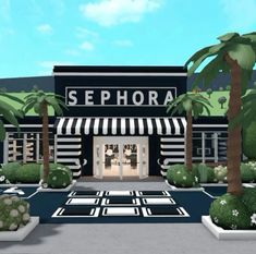 an image of a store front with palm trees in the foreground and landscaping around it