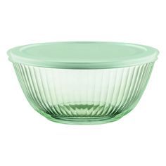 a green glass bowl on a white background