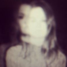 a blurry photo of a woman's face