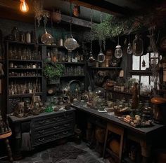 an old fashioned kitchen with lots of pots and pans