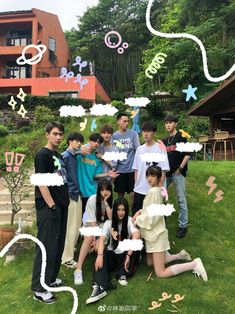 a group of young people standing next to each other on top of a lush green field