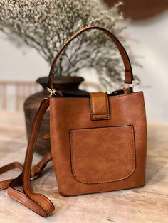 Everyday Bucket Shoulder Bag With Gold-tone Hardware, Gold-tone Hardware Bucket Shoulder Bag, Cognac Bucket Bag For On-the-go, Brown Bucket Bag For On-the-go, Chic Satchel With Gold-tone Hardware Bucket Shape, Chic Bucket Satchel With Gold-tone Hardware, Versatile Brown Bucket Bag For On-the-go, Trendy Bucket Bag With Gold-tone Hardware, Everyday Bucket Satchel With Gold-tone Hardware