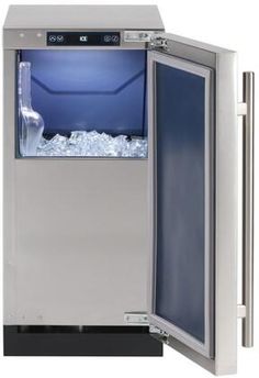 an ice machine with the door open and water inside it's glass bottom compartment