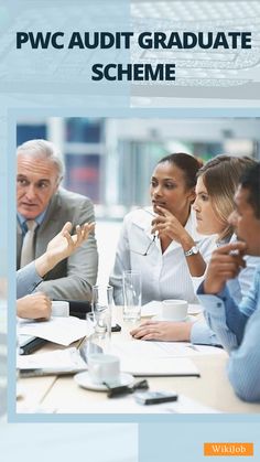 a group of people sitting at a table with papers and pens in front of them