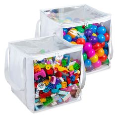 two clear storage bins filled with colorful legos and plastic balls on white background