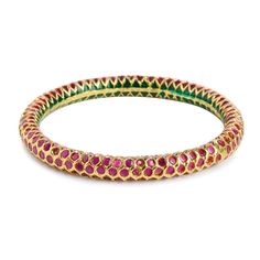 Traditional Indian Emerald Ruby Red stone Studded Punjabi Jadau Delicate and Elegant Bangles. A classic case of chic Indian jewelry with high grade stones and finish ~Comes in sizes 2.2, 2.4, 2.6, 2.8 ~Comes with an openable screw Emboss Work, South Indian work, Temple work, Indian Bangles, Punjabi Jadau, Pakistani Jadau STYLE TIP - Style this with Classic Ethnic Or Indo western wear or lehengas. A perfect match with almost any traditional classic. We love to pair this with rich Banarasi sarees Traditional Ruby Bangle For Festive Occasions, Festive Ruby Jeweled Bracelets, Festive Jeweled Ruby Bracelets, Temple Jewelry Bangle With Gemstones For Festivals, Traditional Red Bracelet With Stone Work, Ceremonial Red Bracelets With Hand Set Details, Ceremonial Red Hand Set Bracelets, Festive Ruby Temple Jewelry Bracelets, Traditional Red Stone Work Bracelet