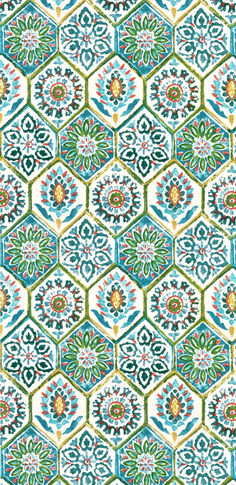 an ornate tile pattern in blue, green and orange colors on a white wallpaper background