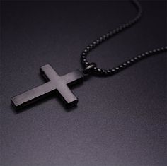 Elevate your style and showcase your faith with our stunning dark wooden cross necklaces for men. Crafted with meticulous attention to detail and using premium materials, our men's cross necklaces are the perfect combination of fashion and spirituality. Material: Top Quality Dark wood + Stainless Steel. Pendant size: 1.06"(27mm) X 1.58"(40mm) Adjustable 56cm-61cm/22"-24" length High Quality Stainless Steel Cross Chain. WARNING: CHOKING HAZARD -- Small parts. Not for children under 3 yrs. Men's Cross Necklaces, Cheap Men's Cross Necklaces, Black Cross Pendant Jewelry For Father's Day, Cheap Men's Cross Pendant Jewelry, Mens Wooden Cross Necklace, Luxury Men's Crucifix Cross Necklace, Cheap Men's Cross-shaped Jewelry, Wooden Cross Necklace, Cross Necklace For Men