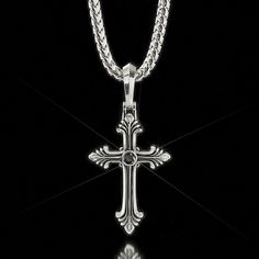 This Silver Cross pendant is a symbol of sacrifice and hope, and the brilliant diamond a representation of life and love. Our silver and diamond cross pendant is designed, sculpted, and handcrafted in the USA. Silver weight is 19 grams. One 4mm Black Diamond or VVS Colorless diamond totaling 0.25 carats is set in the cross. The cross itself measures 38mm (1.5 inches) in length and 25mm (1 inch) in width. The overall length, including the bail, is 56mm (2.2 inches). *Shown on 4mm Diamond Cut Fran Classic Sterling Silver Cross Charm, White Gold Crucifix Necklace Spiritual Style, Classic Engraved Crucifix Cross Necklace, Spiritual White Gold Crucifix Cross Necklace, Spiritual White Gold Crucifix Necklace, Oxidized Sterling Silver Cross Pendant Necklace, Sterling Silver Oxidized Crucifix Necklace, White Gold Crucifix Necklace, Spiritual Polished Cross Jewelry And Charms