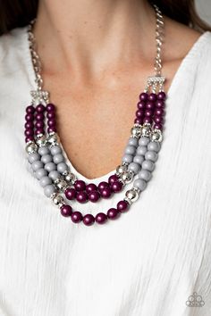 Infused with glittery hints of white rhinestone encrusted silver rings, a shiny collision of plum and gray beads are threaded along invisible wires below the collar, creating colorful layers. Features an adjustable clasp closure.

 Sold as one individual necklace. Includes one pair of matching earrings. Bling Necklace, Grey Beads, Purple Necklace, Paparazzi Accessories, White Rhinestone, Paparazzi Jewelry, Yellow Purple, Short Necklace, Gorgeous Jewelry