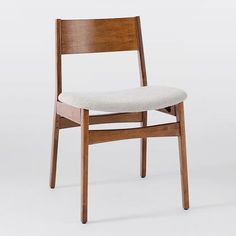 a wooden chair with a white upholstered seat and back rest, viewed from the front