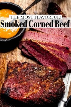 the most flavored smoked corned beef is served on a cutting board with dipping sauce