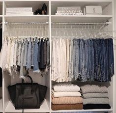 an organized closet with clothes and handbags