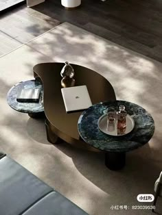 a coffee table with a laptop on it in the middle of a living room area