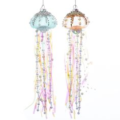 two glass jellyfishs hanging from strings with beaded beads and pearls on them