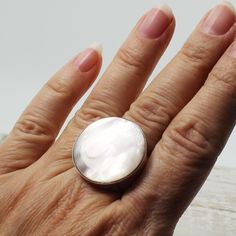 A beauty... quality Mother of pearl shell very white elegant ring and amazing round inlaid bezel set on 925 solid silver, quality solid and unique jewelry hypoallergenic silver  Dimensions Length : 26 mm (1.00")  Width : 26 mm (1.00") Height : 5 mm (0.20") Weight 12.3 grams Size : 7 and 8 US,CA / 54 and 57 France / -O- and -Q- UK sizing Resizing is available for $20-USD / takes a extra 7 to 10 days before shipping