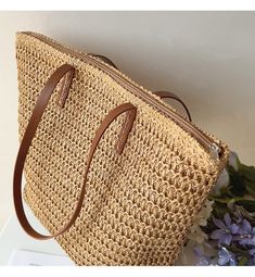 IN STOCK FAST SHIPPING FROM LOS ANGELES The Elena Handbags Straw Woven Tote is a luxurious summer staple crafted out of woven straw and reinforced with leather straps. With its spacious, zippered interior, this bag is the perfect accessory for day trips and evening events alike, offering effortless elegance wherever you go. Size: 30cm wide x 33cm tall (12in x 13in) Designer Style ID: 8322 Large Straw Woven Tote Bag with Leather Straps, Summer Bag, Everyday Shoulder Bag, Beach Bag Everyday Shoulder Bag, Crochet Shoulder Bags, Summer Purses, Summer Tote Bags, Summer Handbags, Straw Tote Bag, Woven Handbags, Straw Handbags, Woven Tote Bag