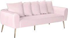 a light pink couch with six pillows on it's back and two gold legs