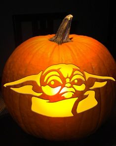 a star wars pumpkin carved to look like yoda from the child's movie