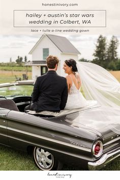 a bride and groom sitting on the back of a convertible car in front of a barn