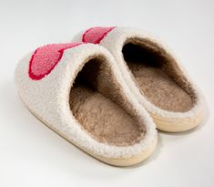 Stay cozy and comfortable all year round with a pair of Heart Slippers. These slippers feature a big, soft pink heart on fuzzy cotton material with a rubber sole so you can wear them both indoors and outdoors. They are perfect for a homey, yet stylish look and feel. Details: Cotton material Rubber Sole True to size. For extra room size up. Care: Spot clean and air/hang dry. Heart Slippers, Room Size, Loungewear Sets, Extra Room, Heart On, Stay Cozy, Car Decor, Top Dress, Baby Sets