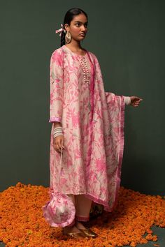 Pink chanderi silk kurta with floral and bird print. Paired with cotton pant and dupatta.
Component: 3
Pattern: Printed
Type Of Work: Floral, bird
Neckline: Round
Sleeve Type: Three quarter
Fabric: Chanderi silk, cotton
Color: Pink
Other Details: 
Fringe border
Pearl embroidered placket
Note: Hair accessory and potli bag shown in the image is not for sale
Occasion: Sangeet - Aza Fashions Kurta Set For Women, Potli Bag, Types Of Work, Silk Kurta, Potli Bags, Luxury Sale, Bird Print, Kurta Set, Cotton Pants