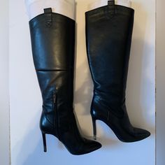 Black. Leather. Point Toe Boot. Knee Height. Slightly Worn. Good Condition. Side Zipper. Fitted Faux Leather Boots For Formal Occasions, Formal Fitted Faux Leather Boots, Sleek Formal Heeled Boots In Faux Leather, Black Snip Toe Heels For Work, Black Snip Toe Heeled Boots For Formal Occasions, Classic Faux Leather Heeled Boots For Evening, Classic Evening Heeled Boots In Faux Leather, Classic Black Heeled Boots For Evening, Elegant Faux Leather Knee-high Boots For Formal Occasions