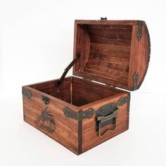 an open wooden box with a handle on the lid and handles to the inside, sitting on a white surface