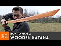 a man holding a large wooden knife in his hand with the words how to make a wooden